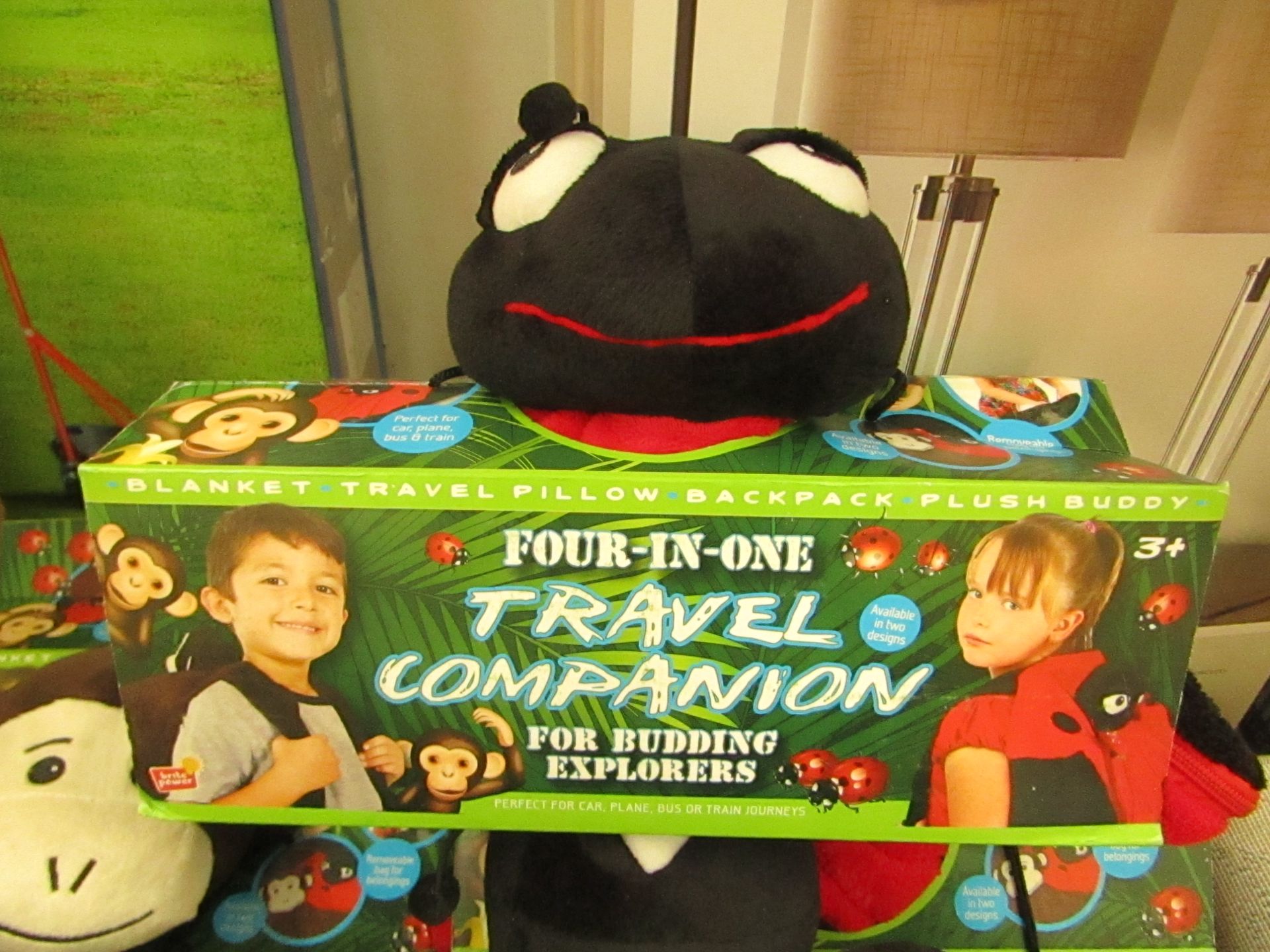 4 in 1 Travel Companion, it is a Blanket, pillow, back pack and Plush Buddy, new