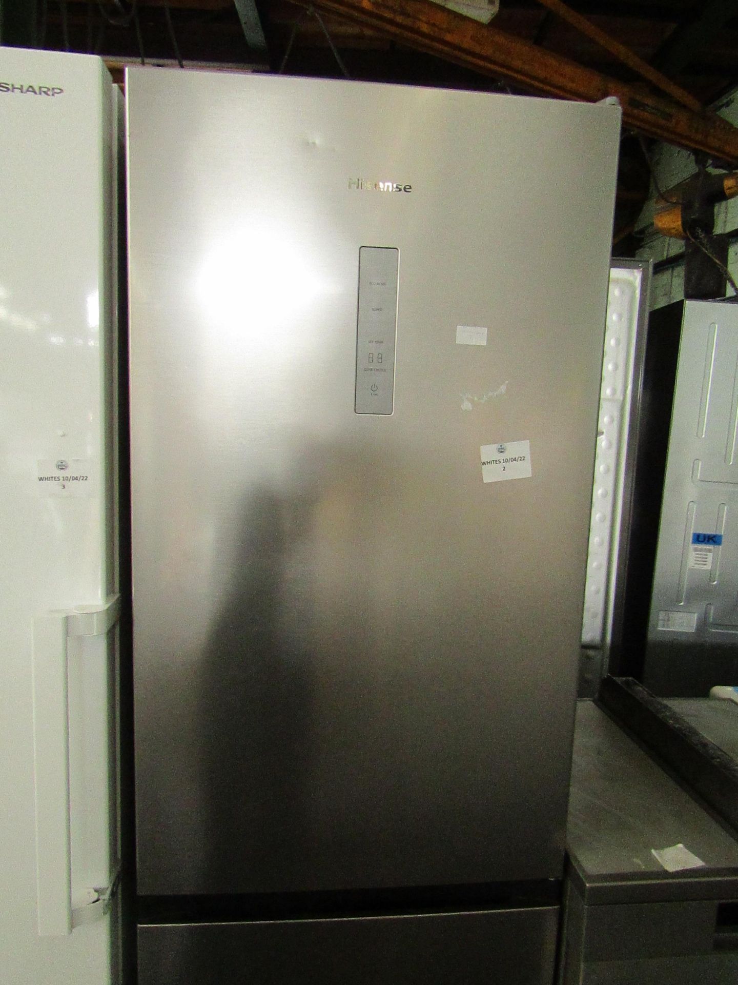 Hisense 60/40 fridge freezer, clean inside and a couple of small dents on the fridge door, tested