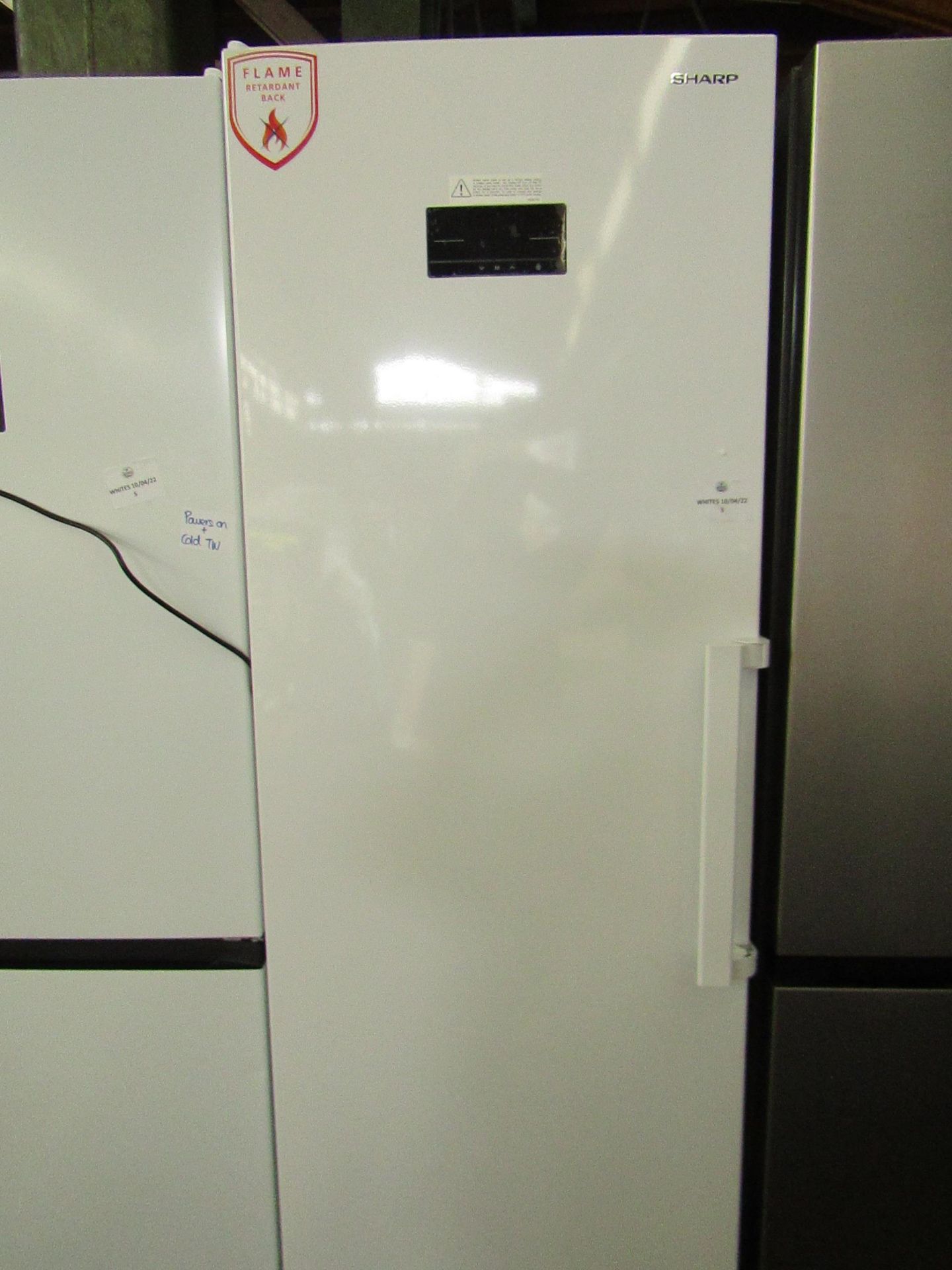 Sharp Tall Freestanding Freezer, clean inside, One of the covers is missing off the door handle