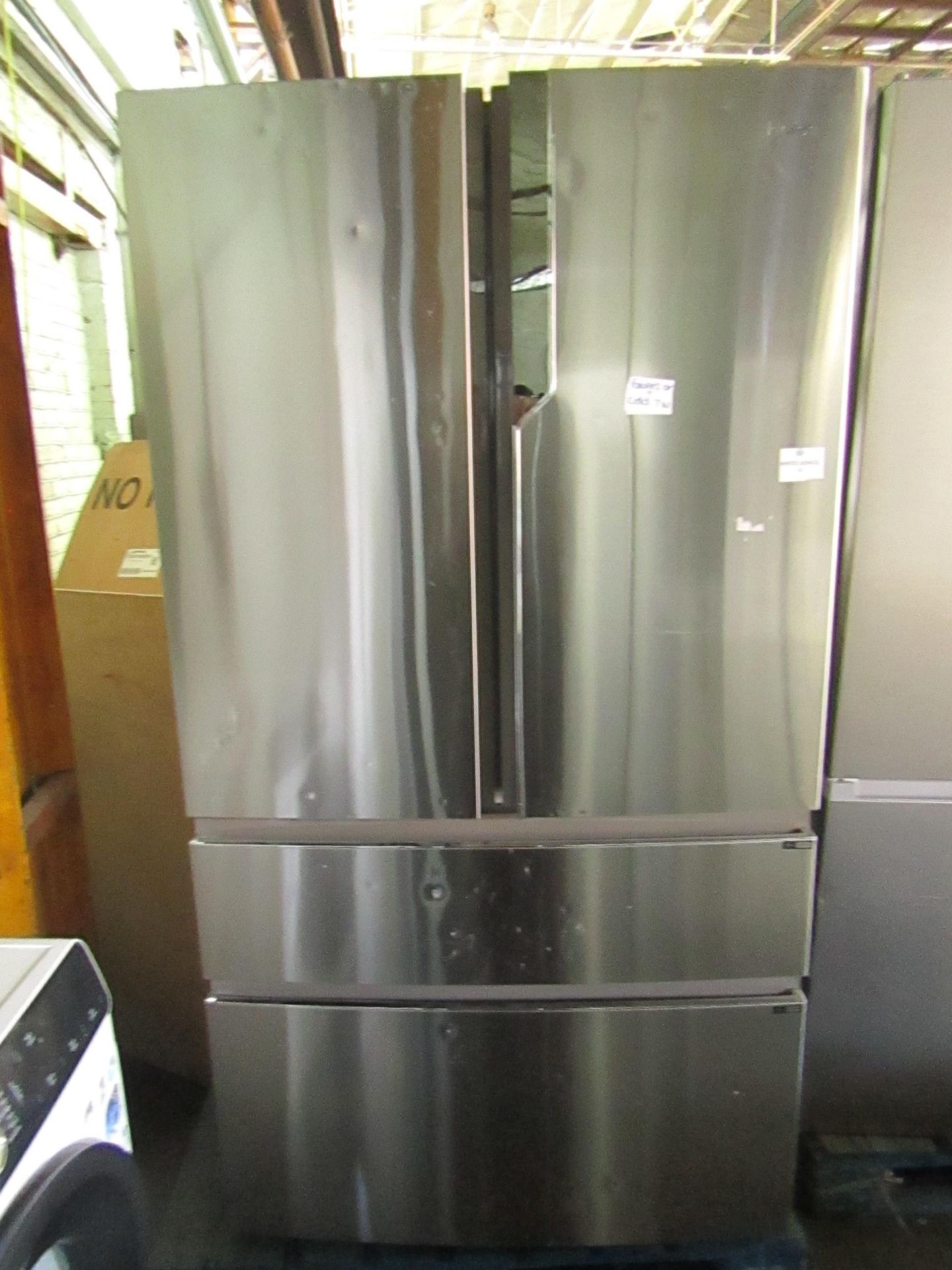 Haier American firdge freezer, clean insode and has some marks and dents on the front and the