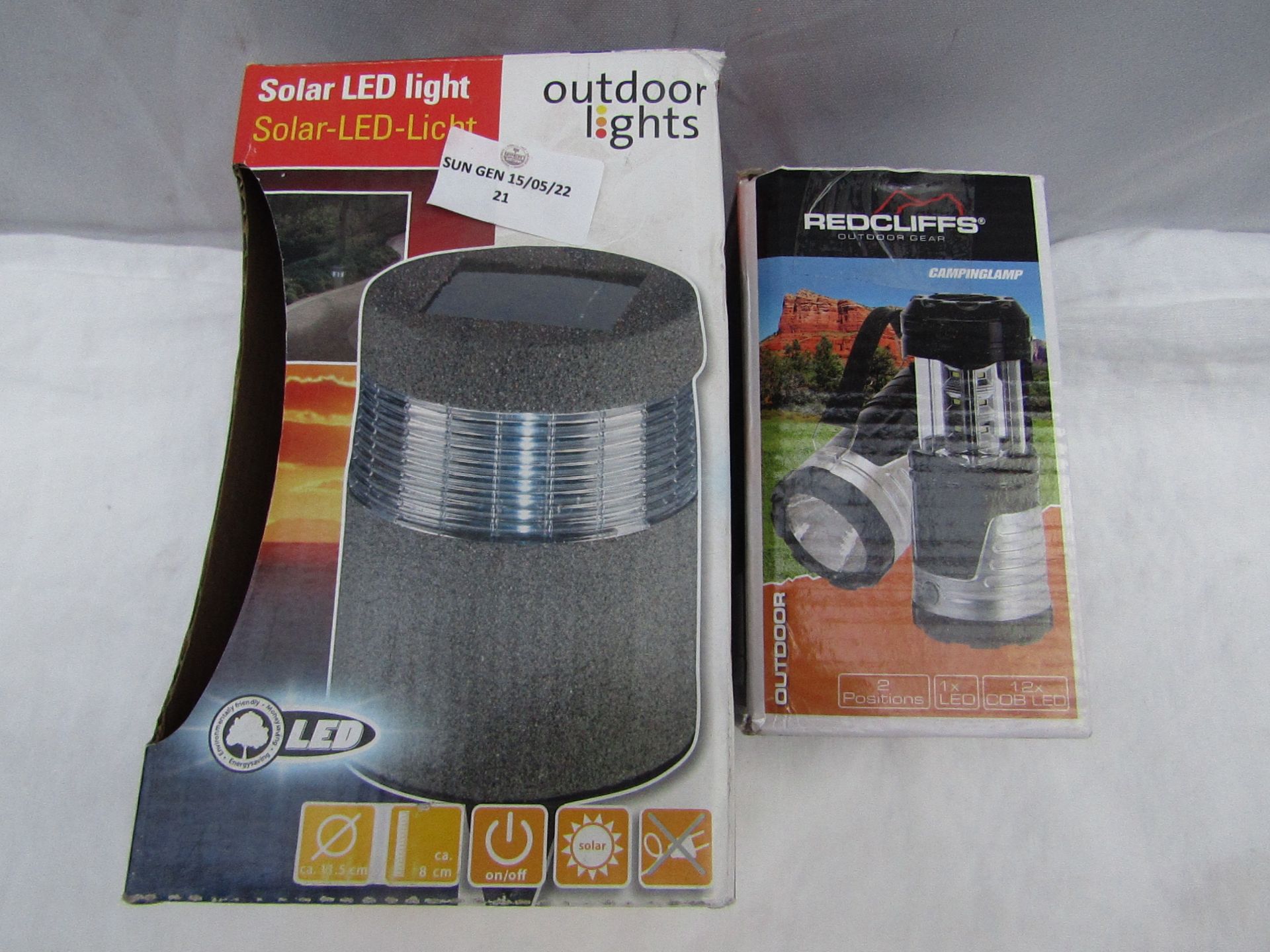 1x Redcliffs - LED Camping Lamp - Unchecked & Boxed. 1x Outdoor Lights - Solar LED Light - Unchecked