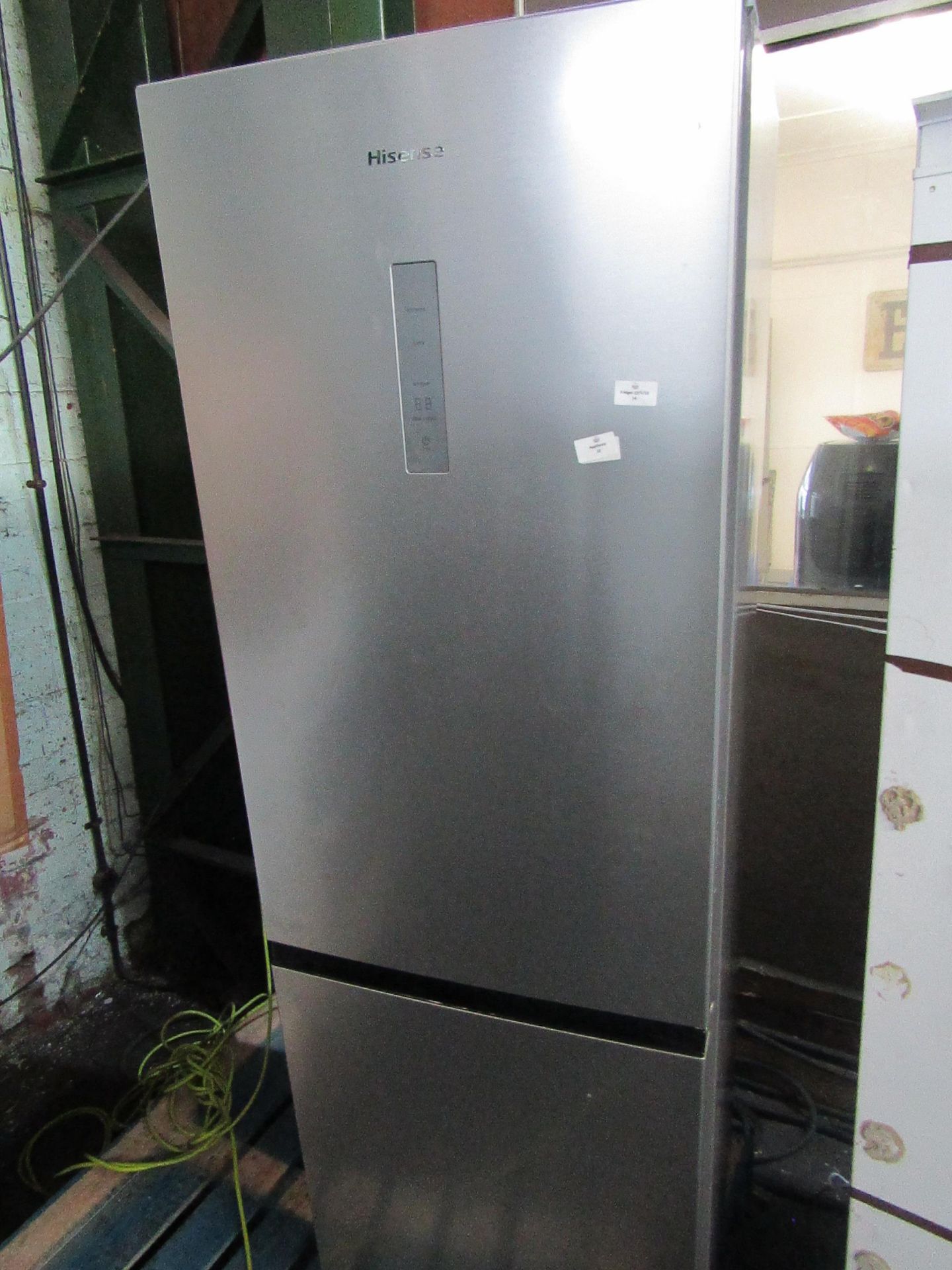 Hisense 60/40 fridge freezer, could do with a wipe over but no major damage, Both Fridge and Freezer