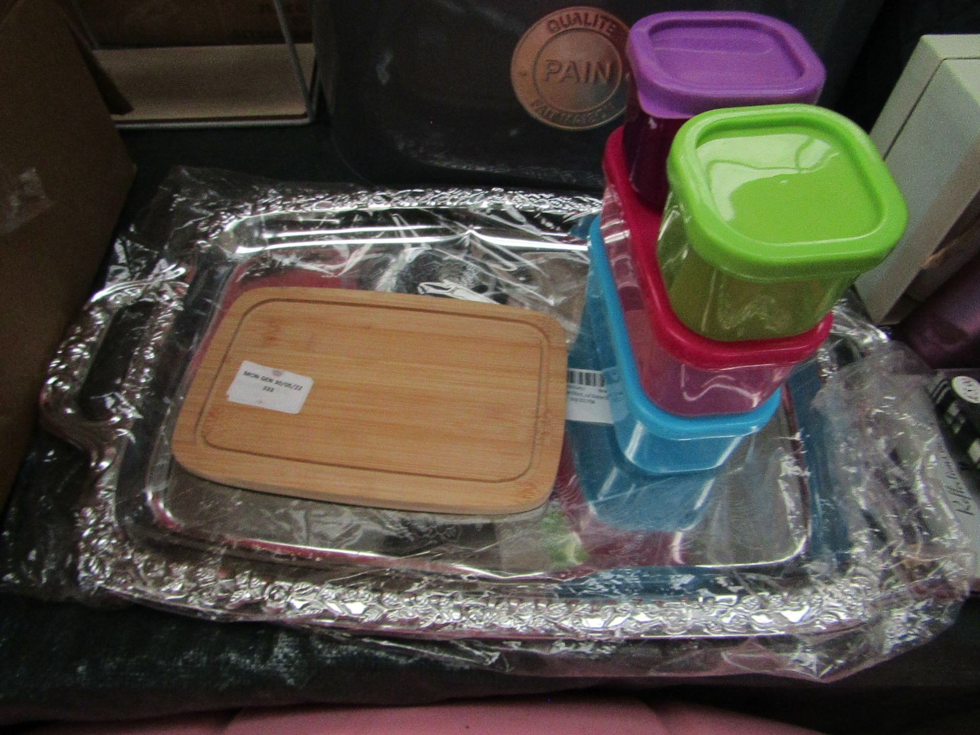 1x Small 4-Piece Plastic Boxes - No Packaging. 1x Small Bamboo Chopping Board - No Packaging. 1x
