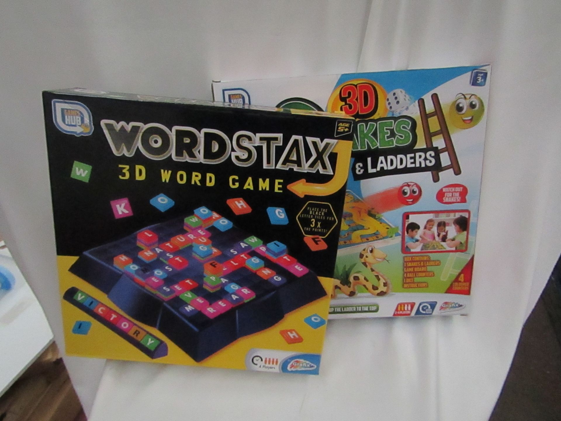 1x Games Hub - 3D Snakes & Ladders Board Game - Unchecked & Boxed. 1x Games Hub - 3D WordStax Word