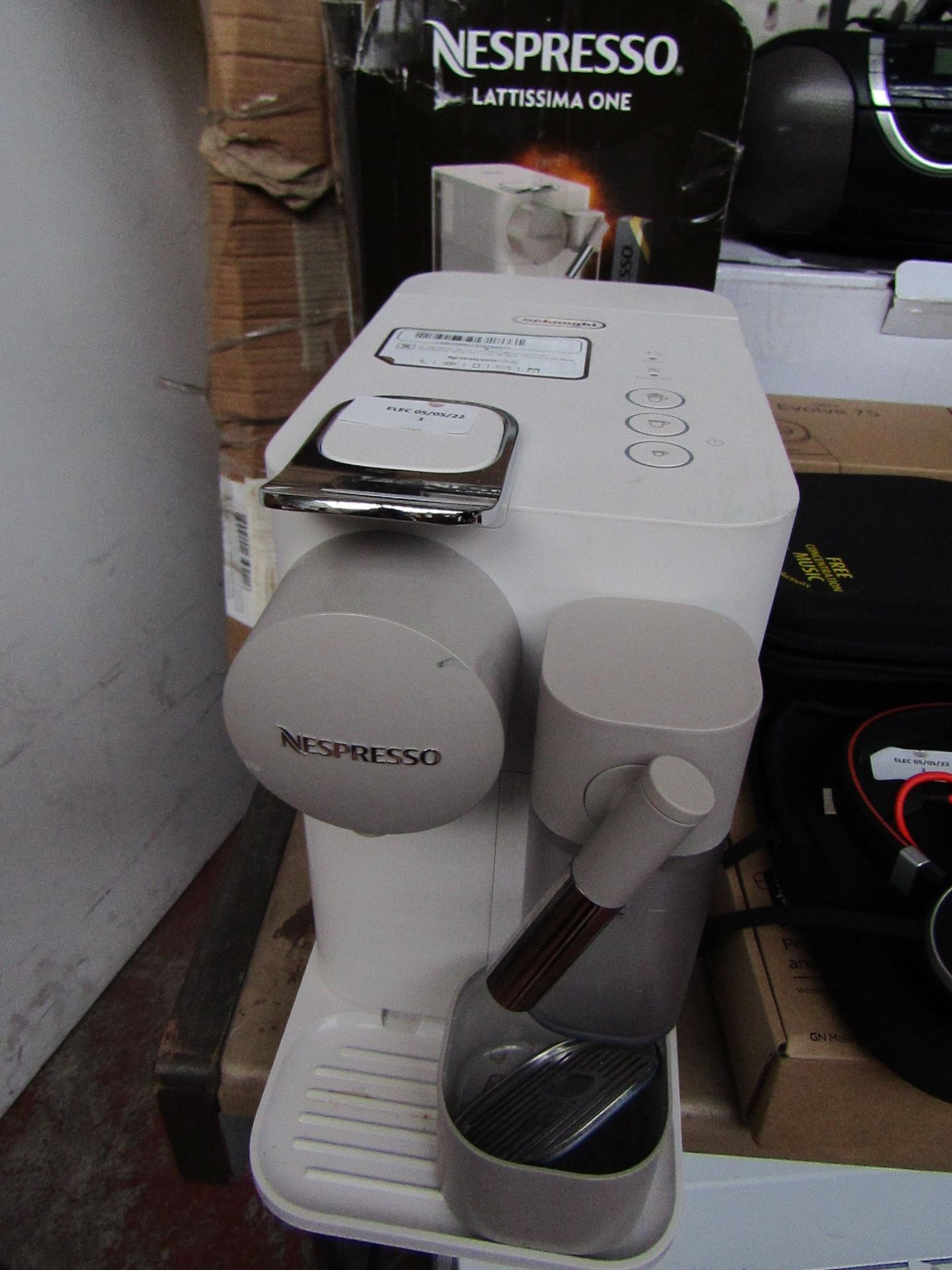 Delonghi Lattissima one coffee capsule machine with Milk dispenser, tested working but the box is