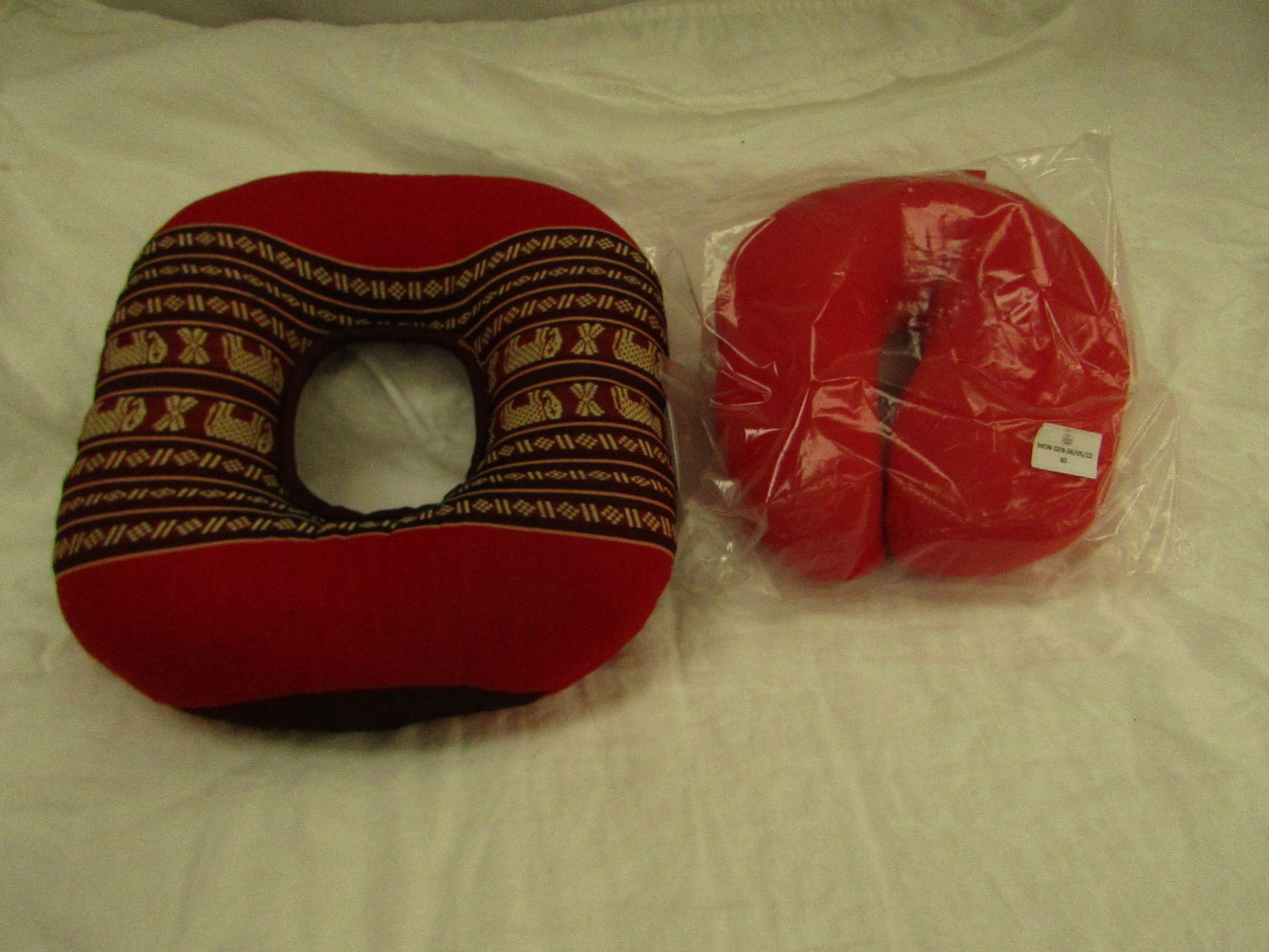 1x Unbranded - Red Neck Cushion - Non Original Packaging. 1x Circular Seat Cushion - No Packaging.