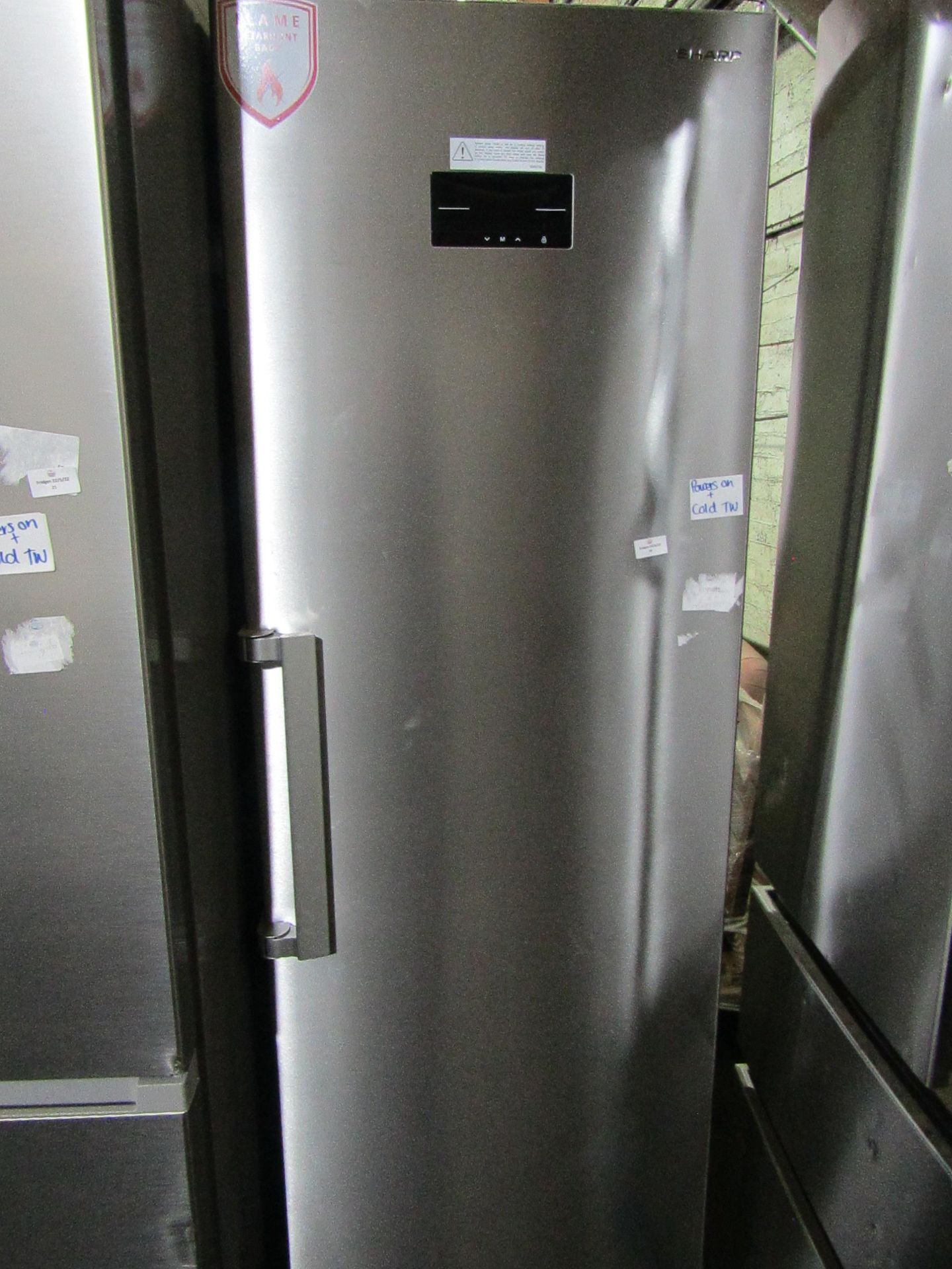Sharp tall freestanding fridge, Clean Inside Marks Present On Bottom. - Powers On & Gets Cold.