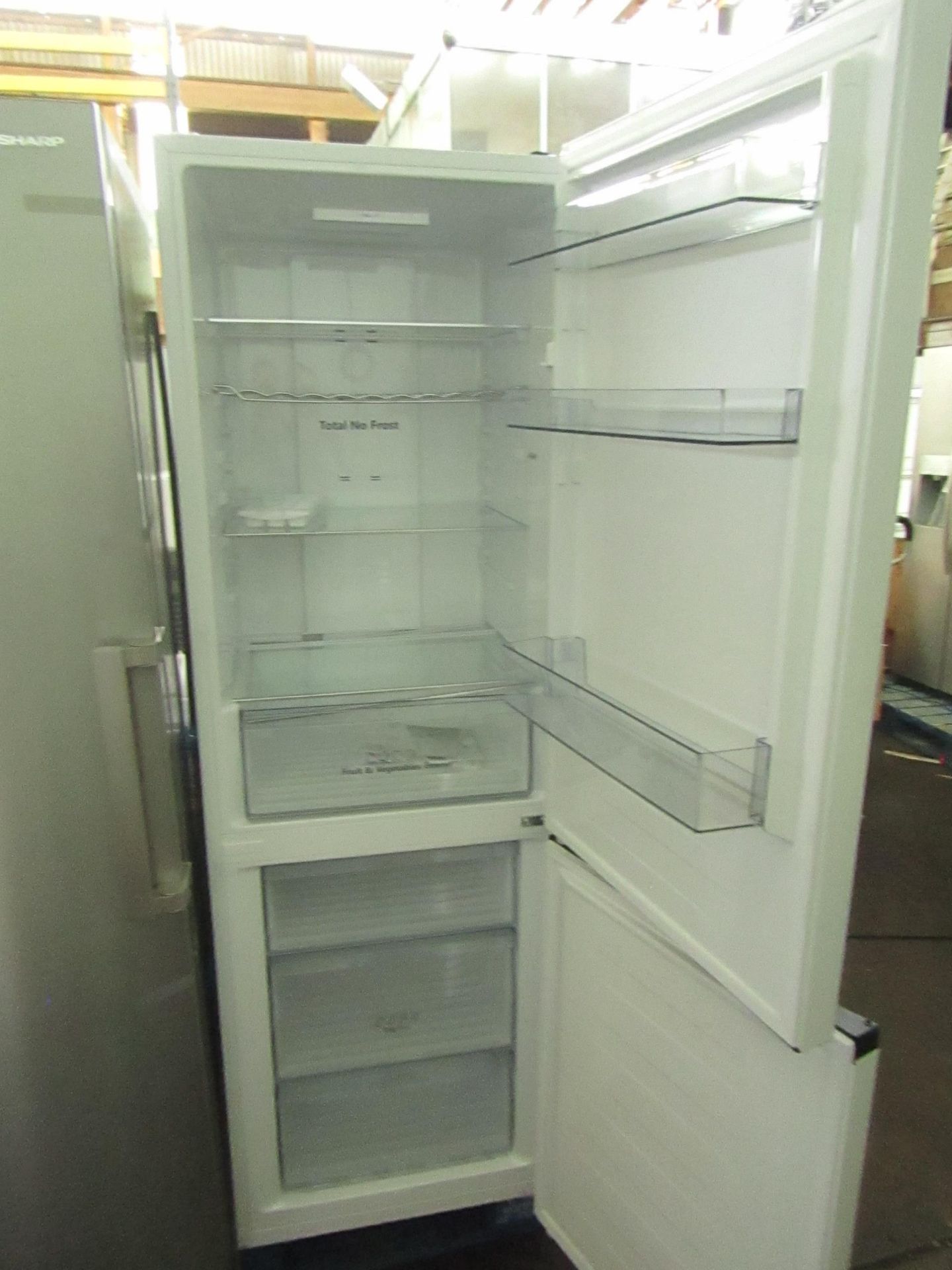 Hisense 60/40 Fridge freezer, Powers on and gets cold in both fridge and freezer, has a small - Image 2 of 4