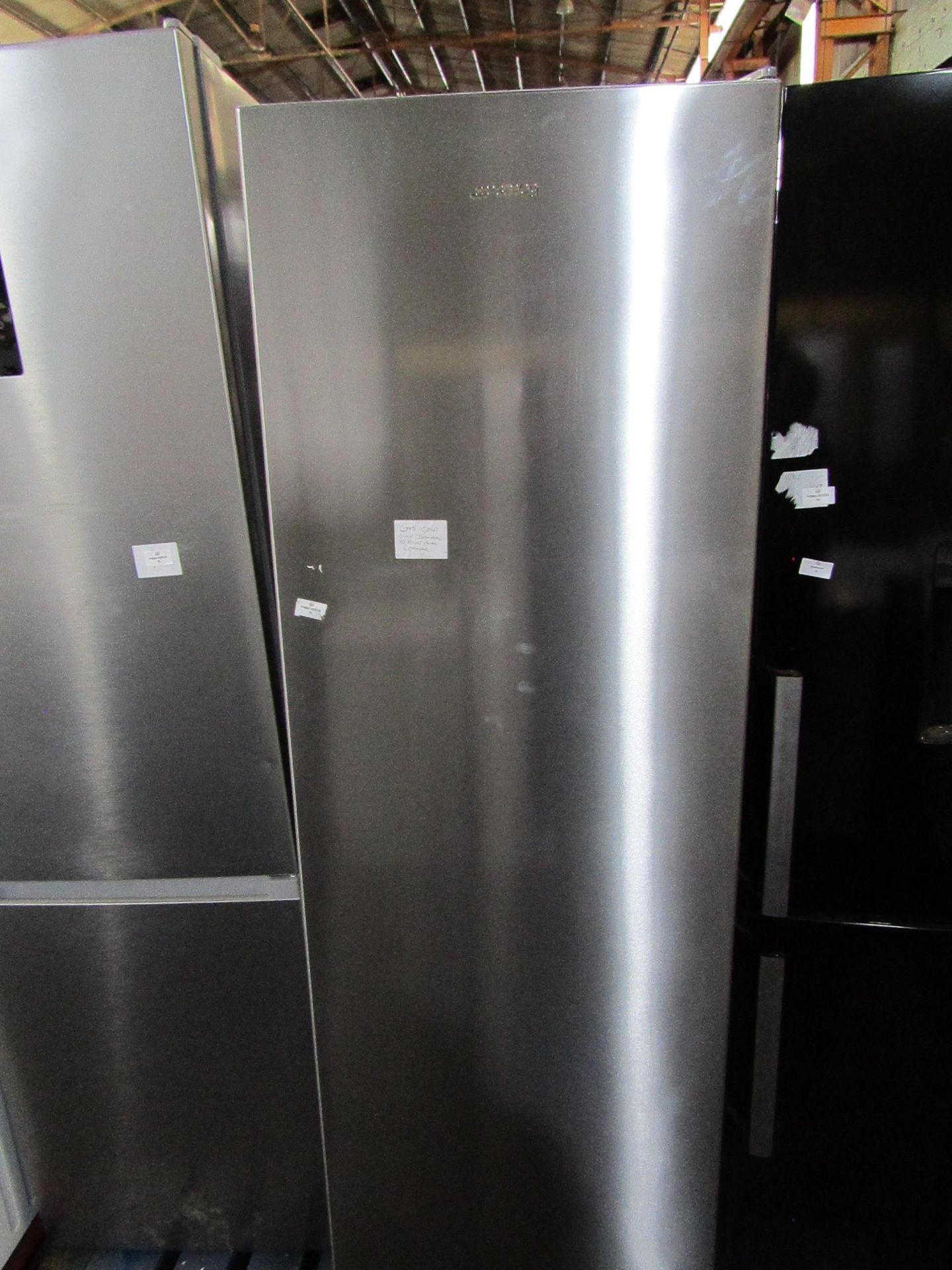 Smeg tall freestanding fridge, tested working but has exterior damage on the bottom corner.