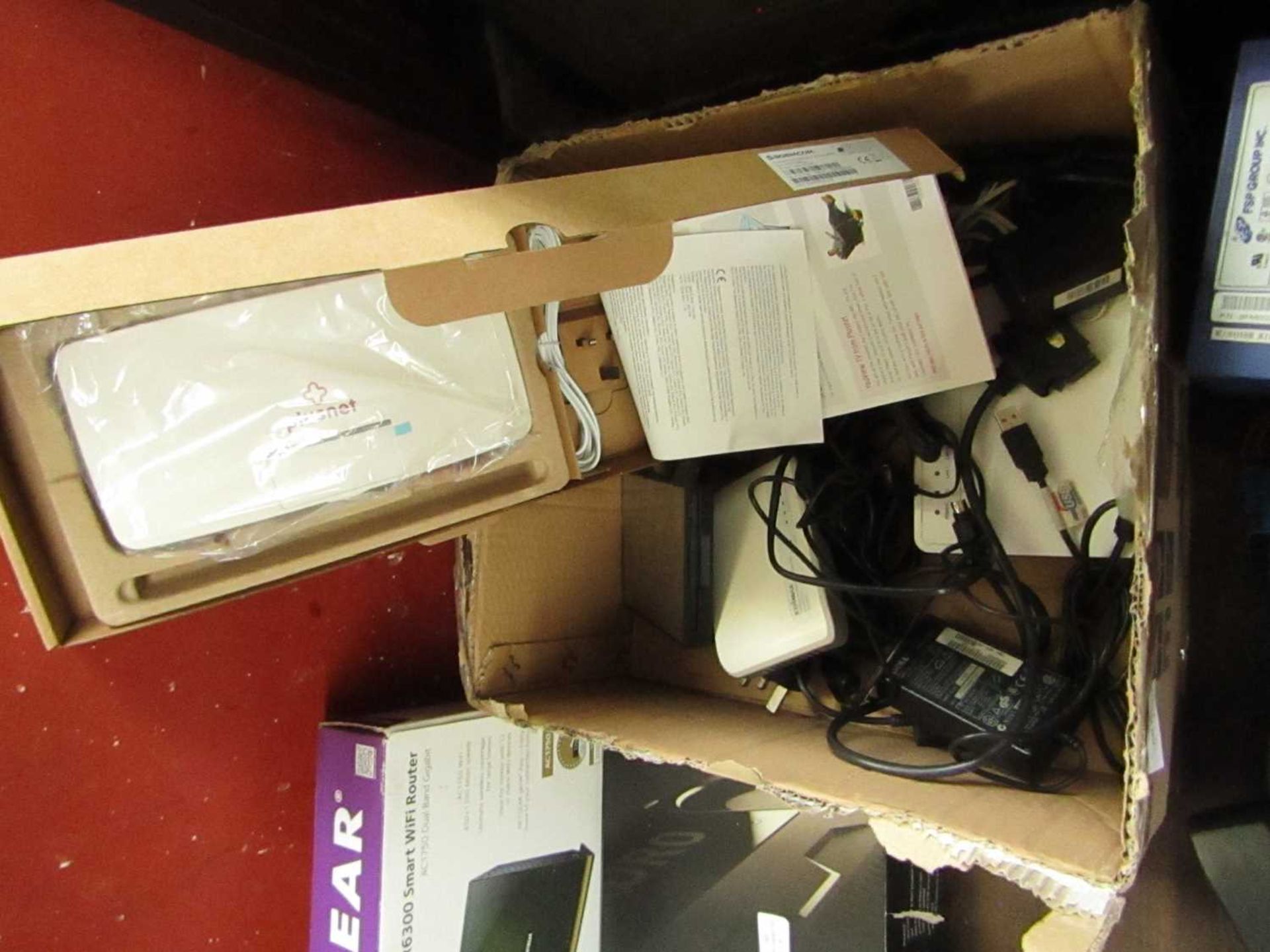 Box of Mixed Routers and Cables