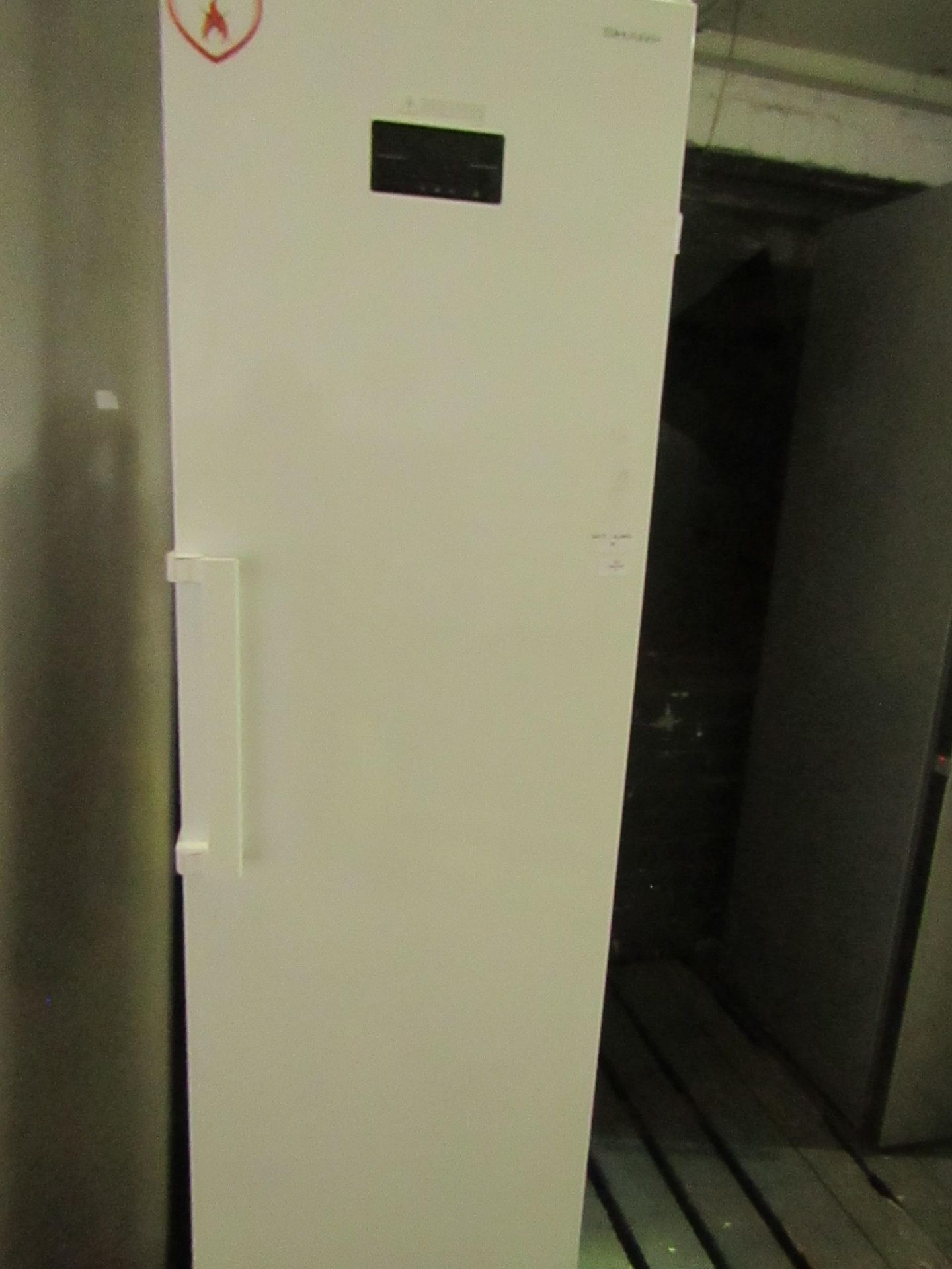 Sharp tall fridge, powers on and gets cold, looks in good condition