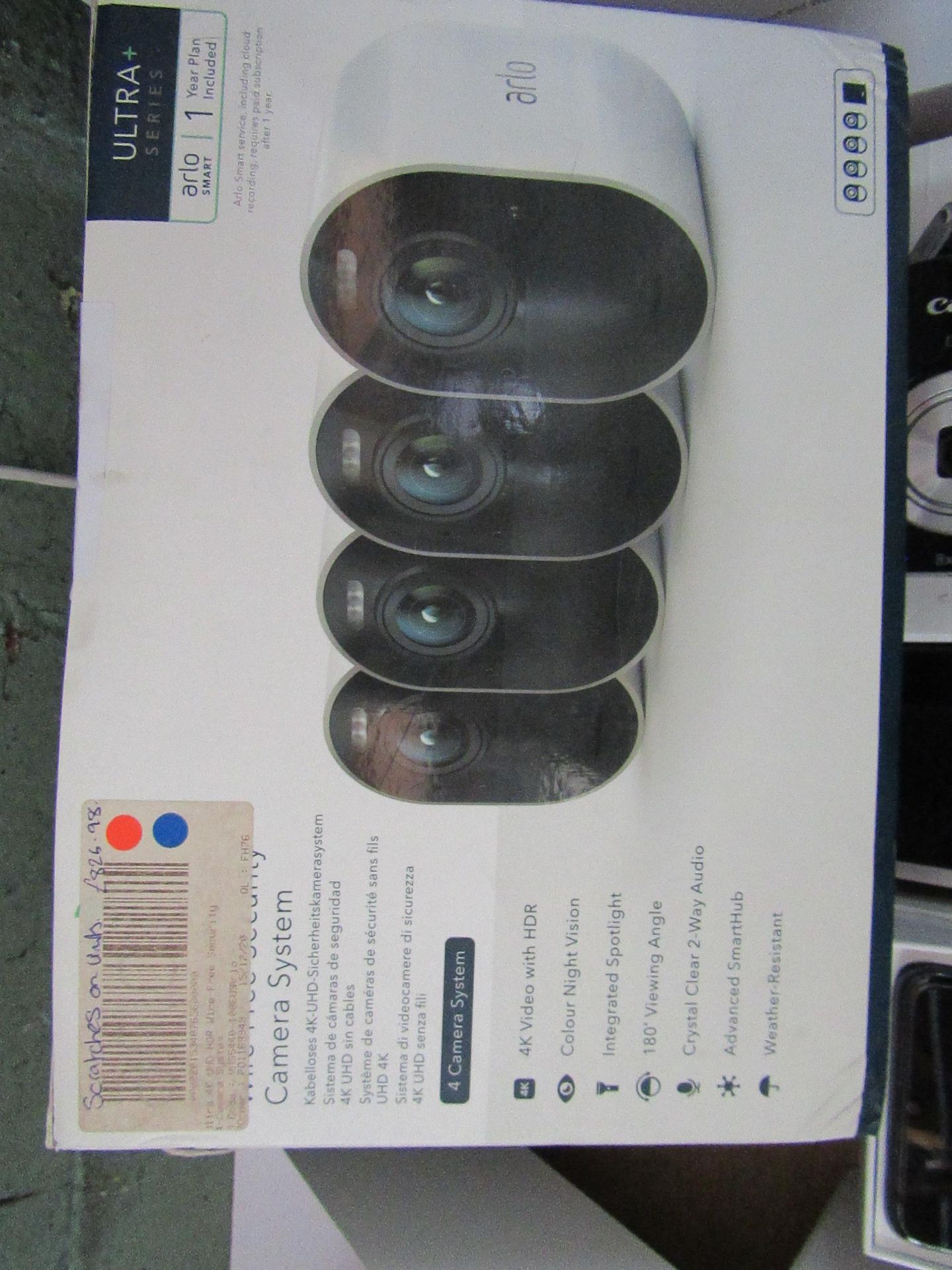 Arlo ultra series 4k wire free camera system with 4 camera system, appears to be cpomplete but