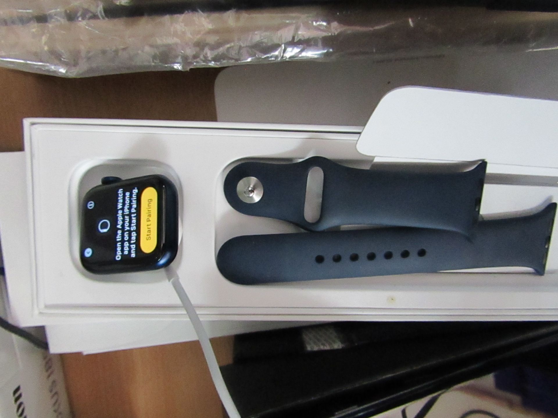 Apple iWatch series 6 40mm with deep Navy band, Model A2291, we powered it up and a member of