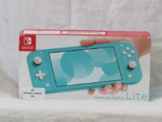 Nintendo Switch Lite hand held games console, powers on and goes to the WIFI set up menu, comes with