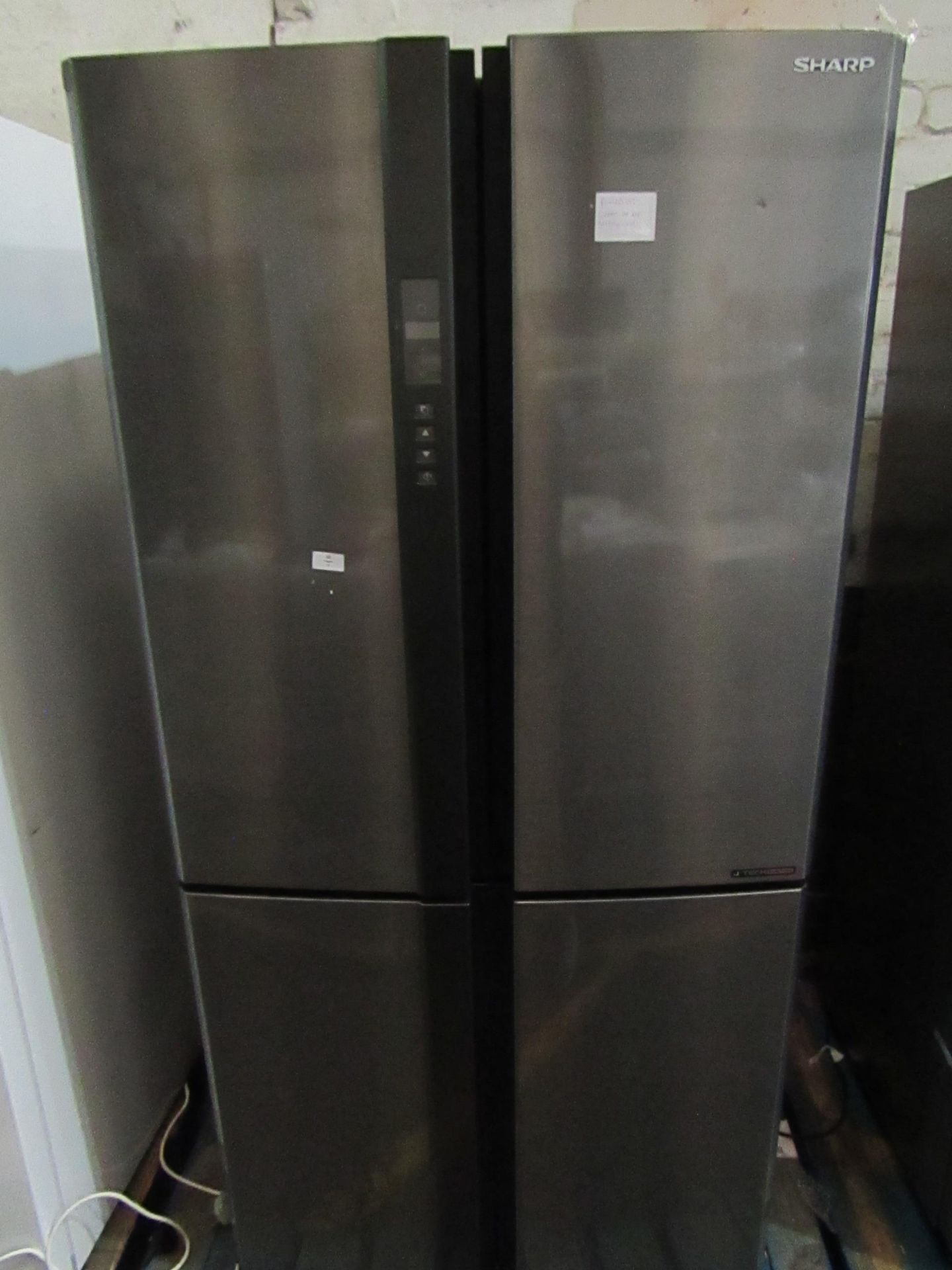 Sharp 4 door american fridge freezer, getting cold in both compartments when plugged in, has a