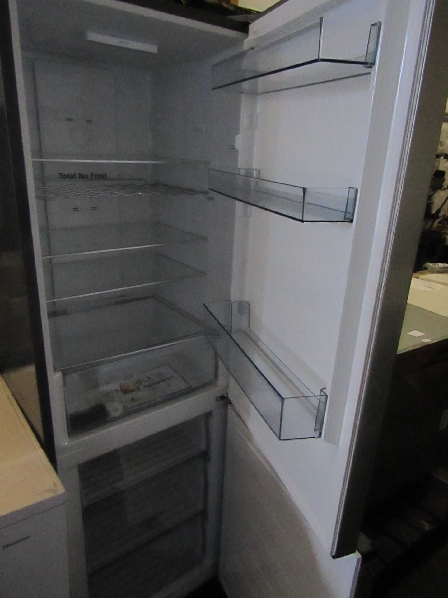 Hisense 60/40 fridge freezer, tested working for coldness, has a few scraps and marks on the - Image 4 of 4