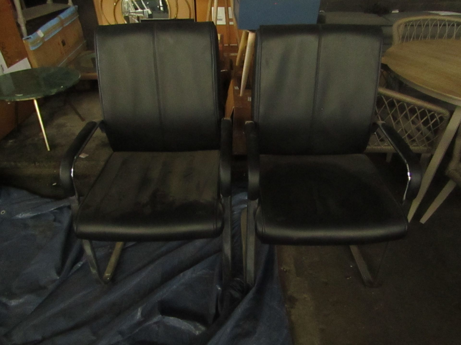 2x Leather chairs, no major damage.