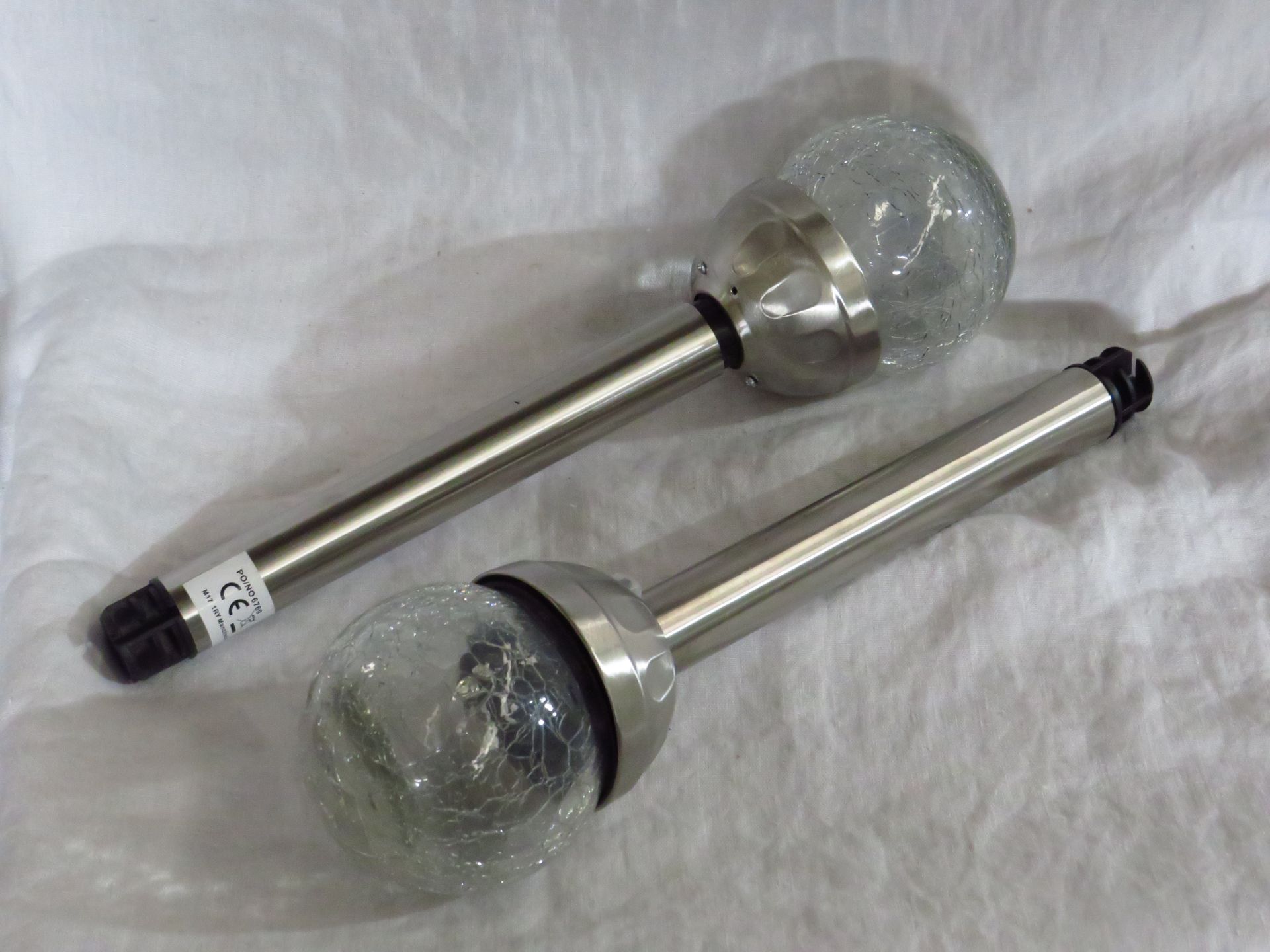 Set of 2x garden solar spike lamps, boxed.