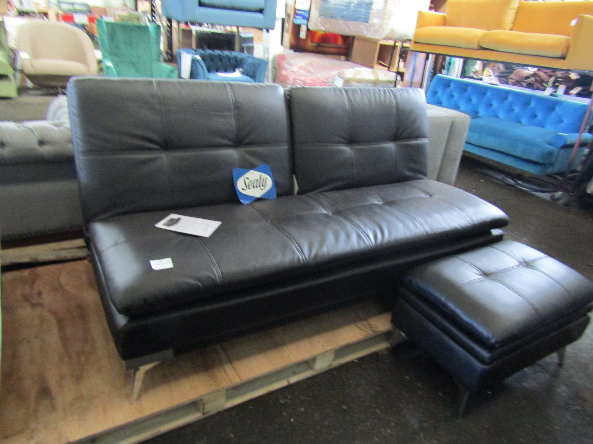 Sealey leather style click clack sofa bed with footstool, a few small marks but overall in good