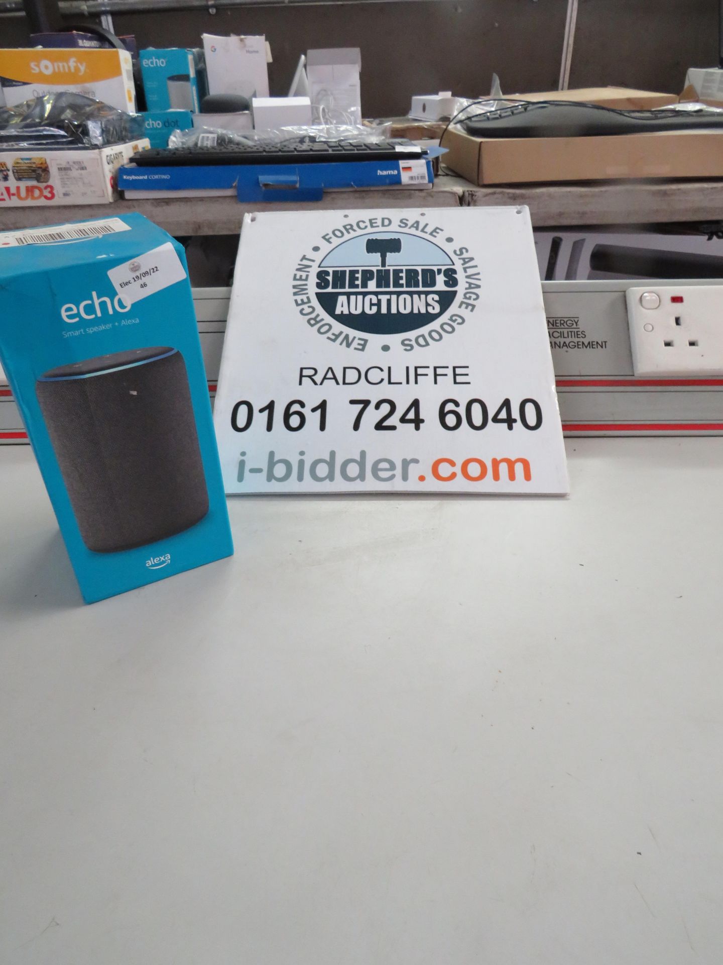 Amazon echo smart speaker with alexa, powers on but we havent checked it any further, comes in