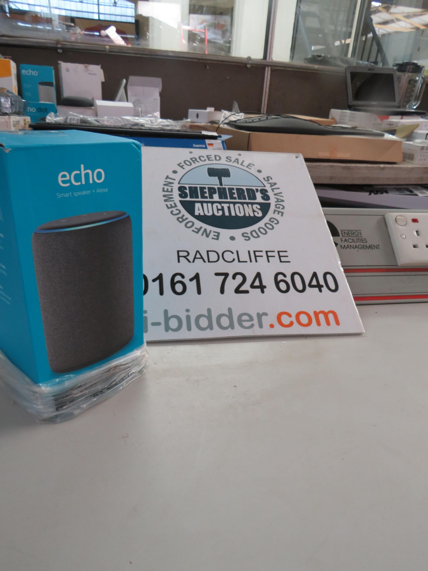 Amazon echo smart speaker with alexa, powers on but we havent checked it any further, comes in