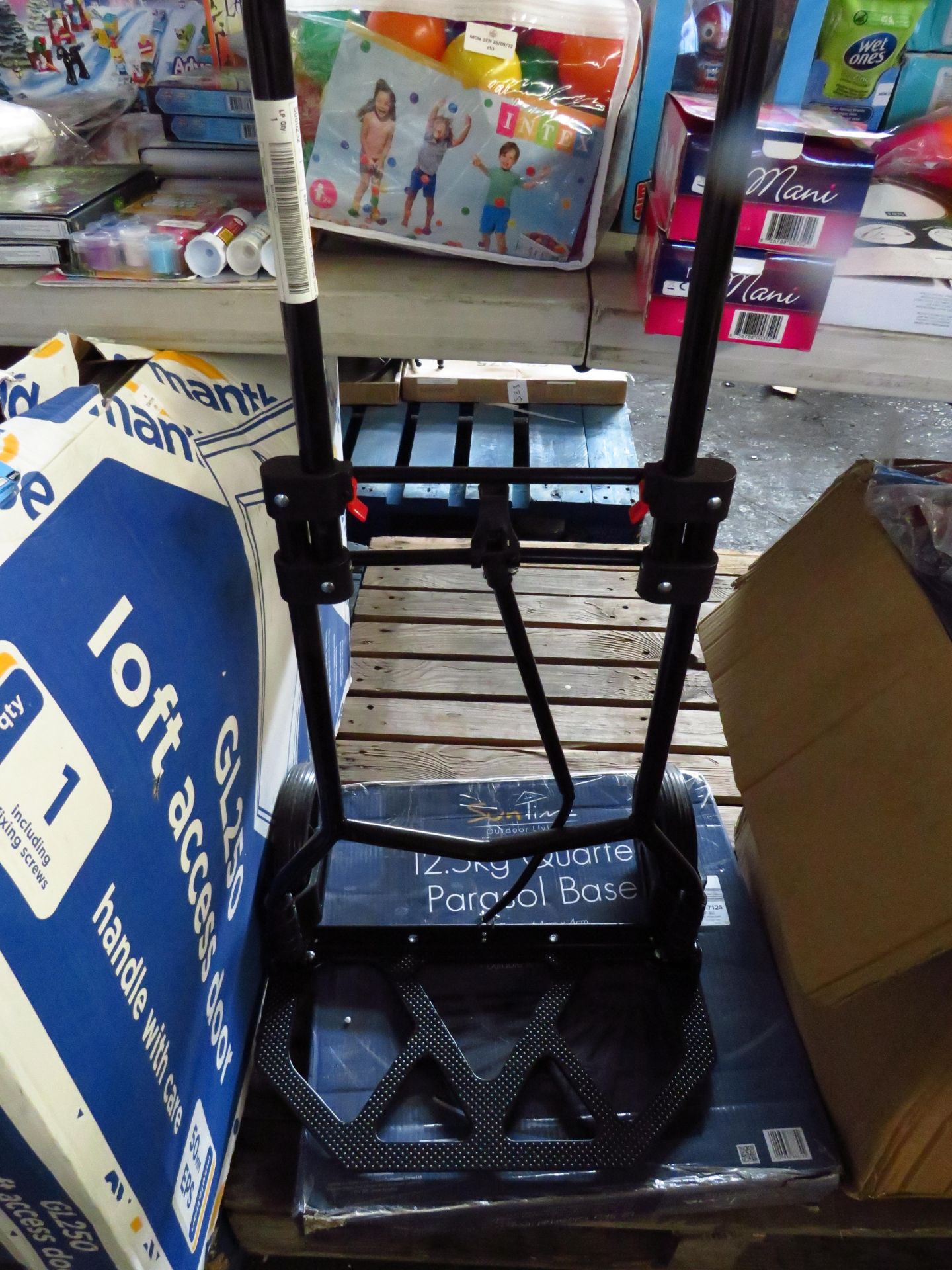 2x itre s being a fold flat sack truck and parasol base weight, both unchecked