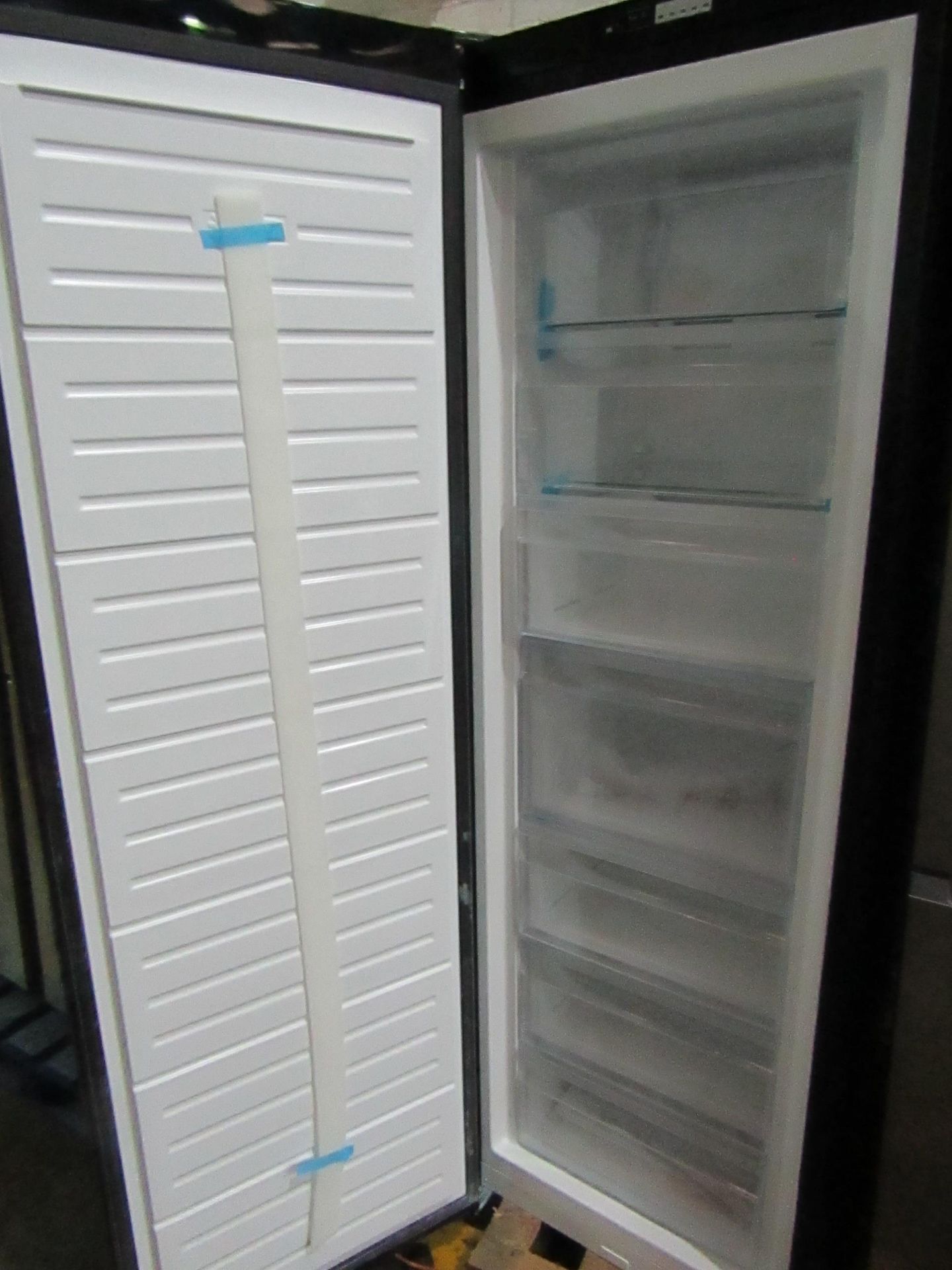 Smeg trall black freezer, tesed working for coldness, has a dent on the door