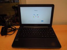 Asus Chromebook C203X 11.6" screen, powers on and appears to be in first person set up, comes with