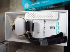 Fitbit Charge 3 special edition, unchecked as it has no power and no charger, comes in originl box
