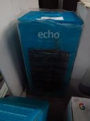 Amazon echo smart speaker with alexa, powers on but we havent checked it any further, comes in