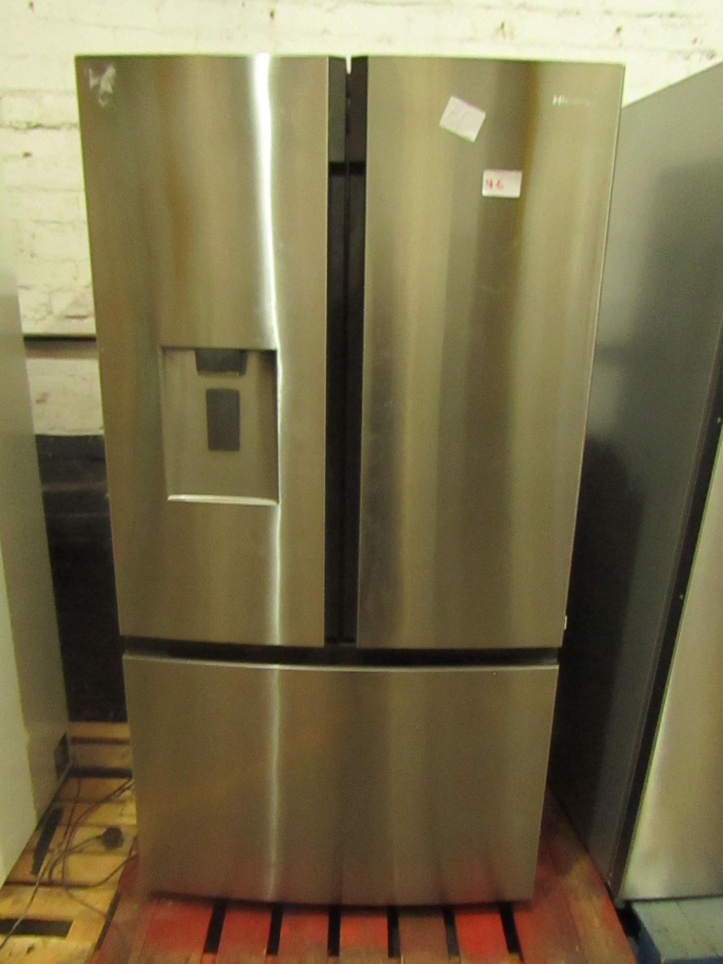 Hisense 3 door American fridge freezer with water dispenser, powers on and freezer appears to work