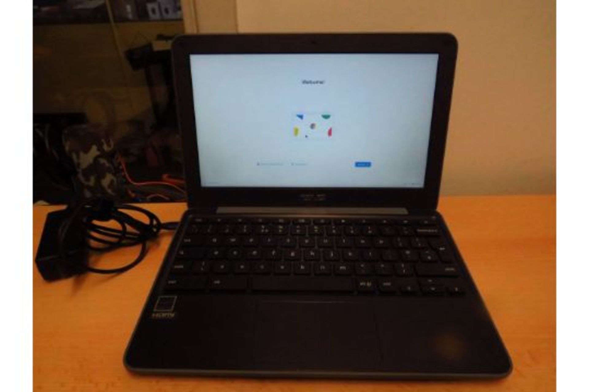 Asus Chromebook C203X 11.6" screen, powers on and appears to be in first person set up, comes with