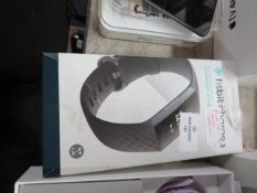 Fitbit Charge 3 Advanced Fittness Tracker boxed powers on and charges