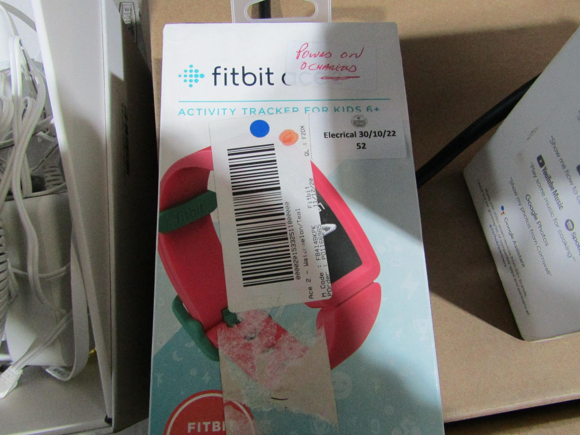 Fitbit Ace2 Activity tracker for Kids boxed powers on and charged