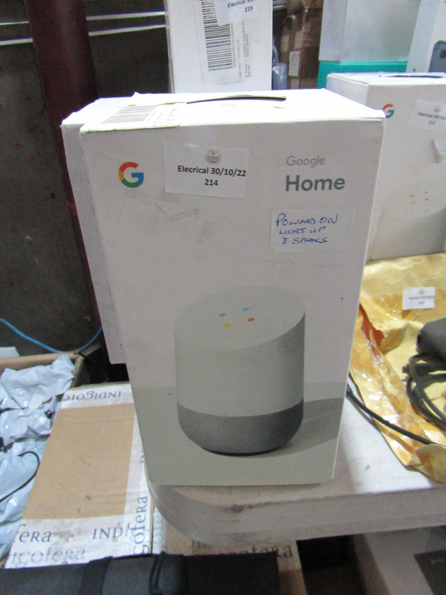 Google Home Smart Speaker, powers on, lights up and speaks in original box