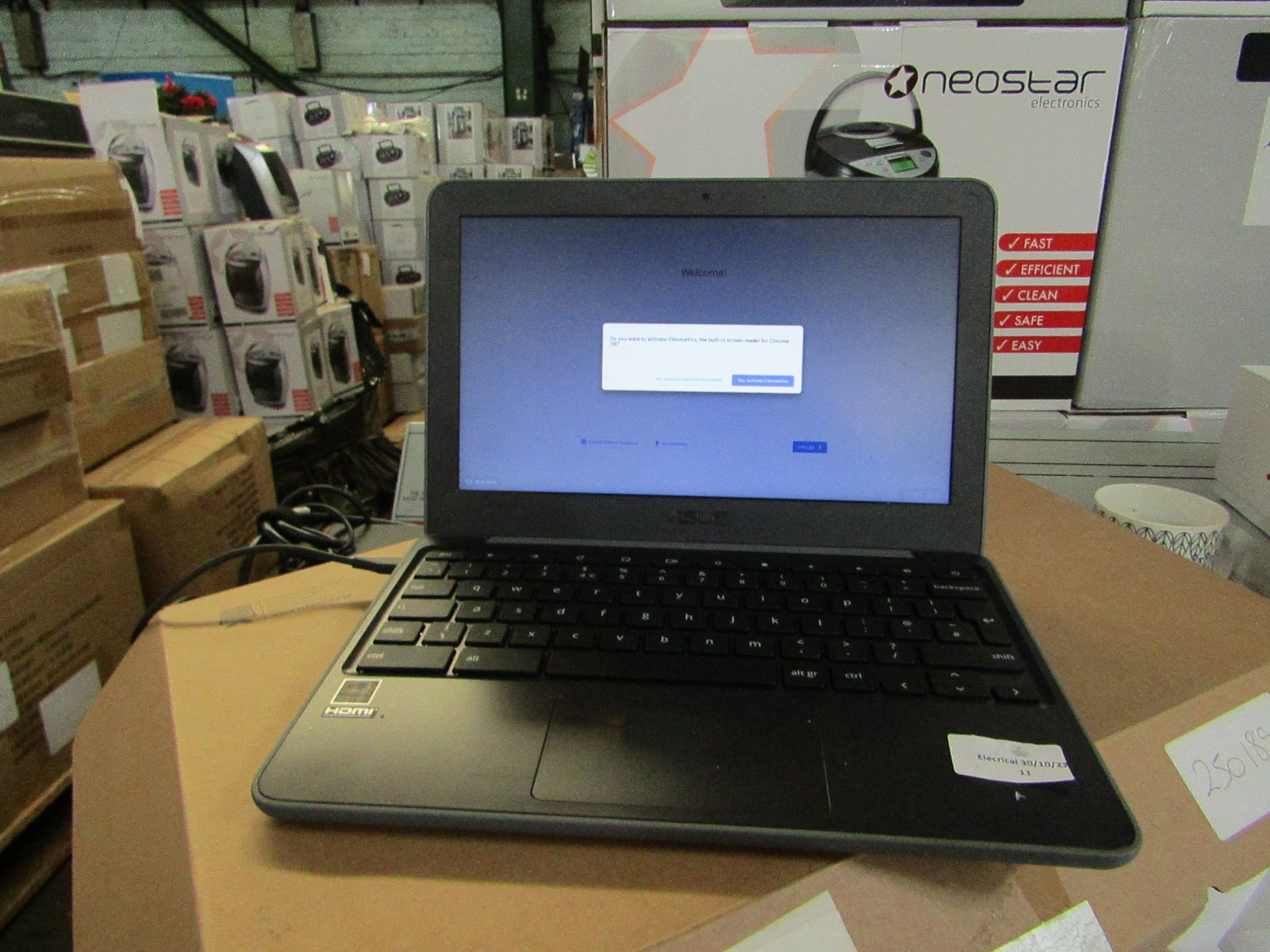 Asus Chromebook C203X 11.6" screen, powers on and appears to be in first person set up, comes with