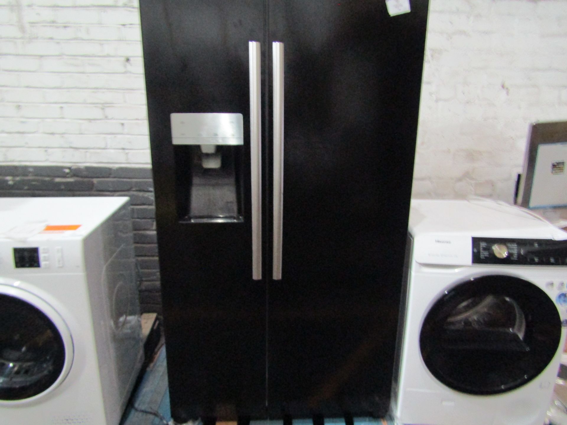 Hisense American fridge freezer with water dispenser, powers on but doesn't get cold