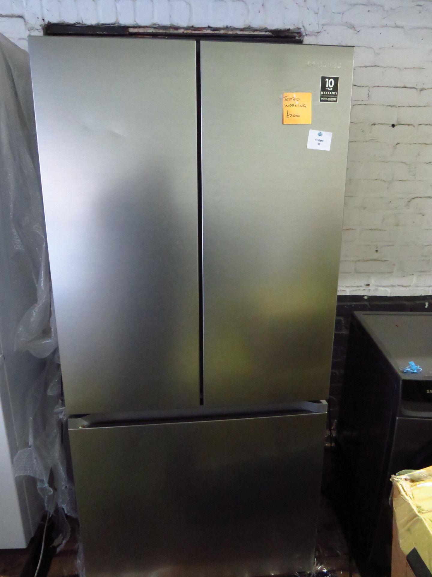 Samsung American style 3 door fridge freezer, tested working for coldness but has 2 dents on top