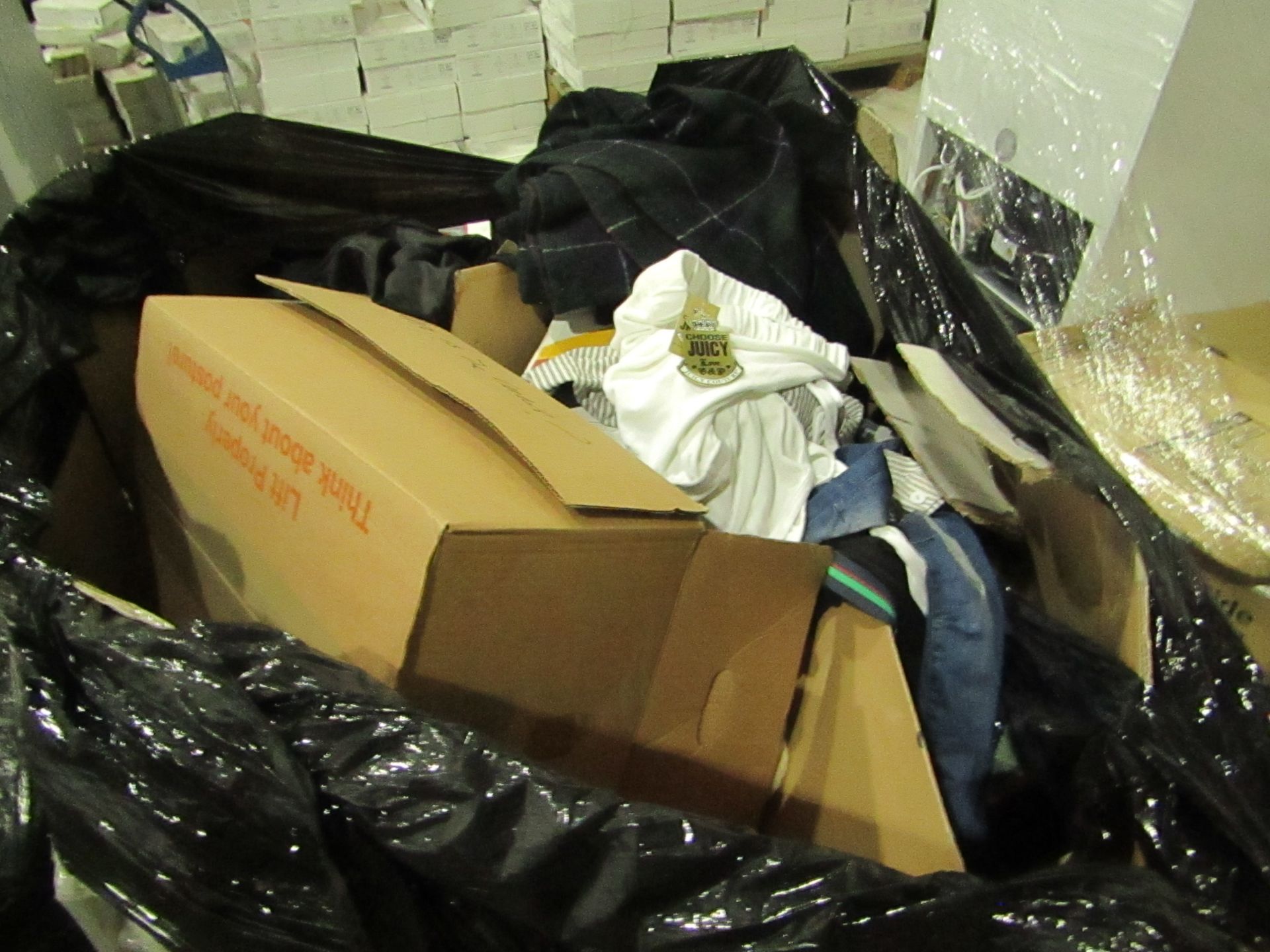 Mixed pallet of non collected customer orders mainly being clothing