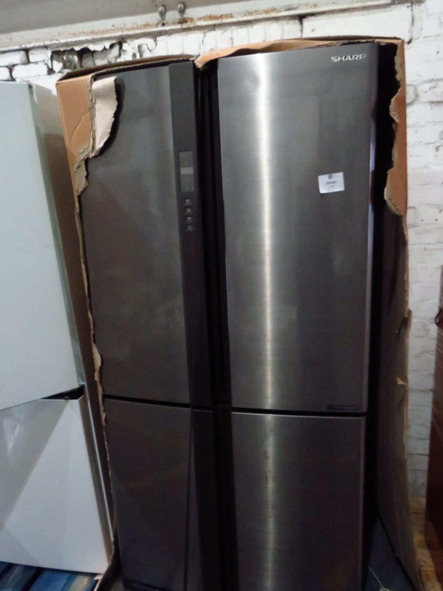 Sharp 4 door American fridge freezer, powers on but not getting cold