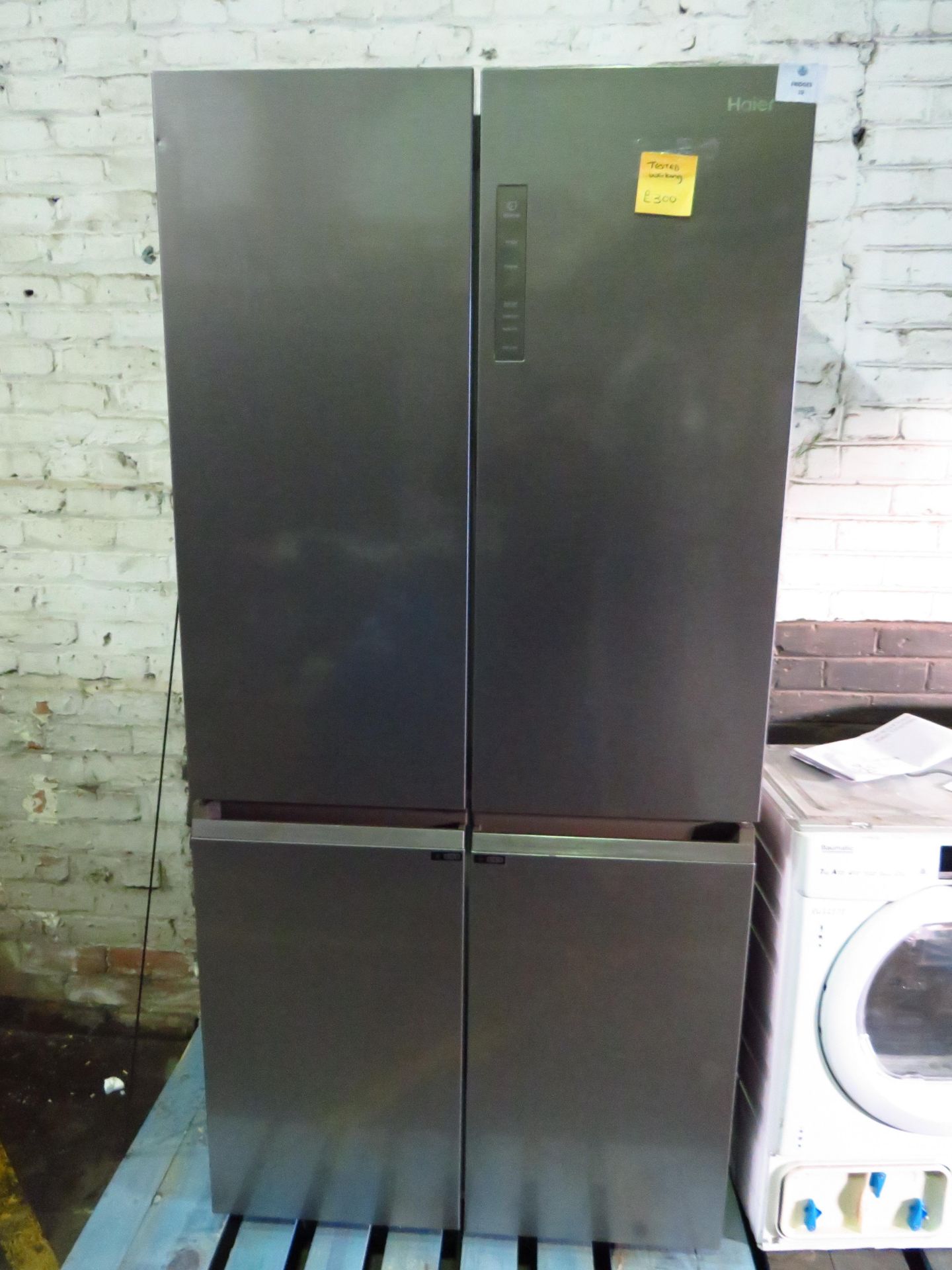 Haier 4 door american style fridge freezer, tested and working for coldness, has a small dent on the