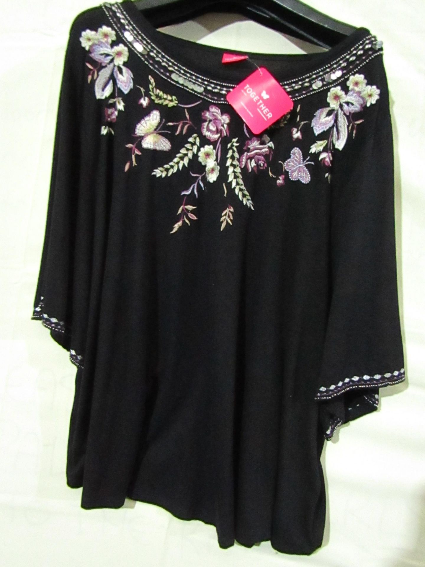 Together women's floral design Top, size 18, new and packaged.