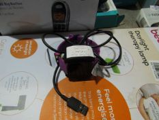 Fitbit Versa LTE edition futness tracker, powers on, with charger