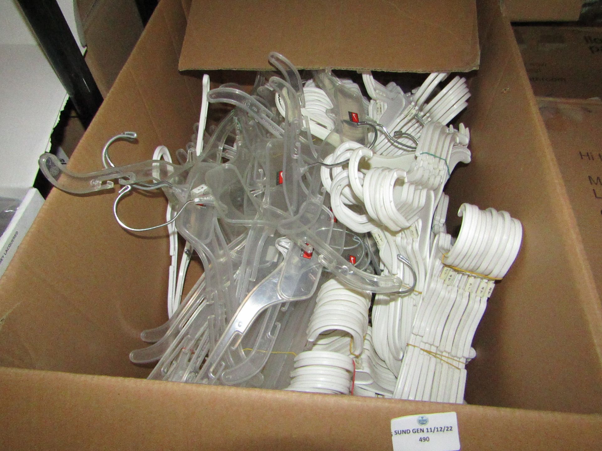 1x Box Containing Approx 100+ Small White Plastic Hangers - Used Condition.