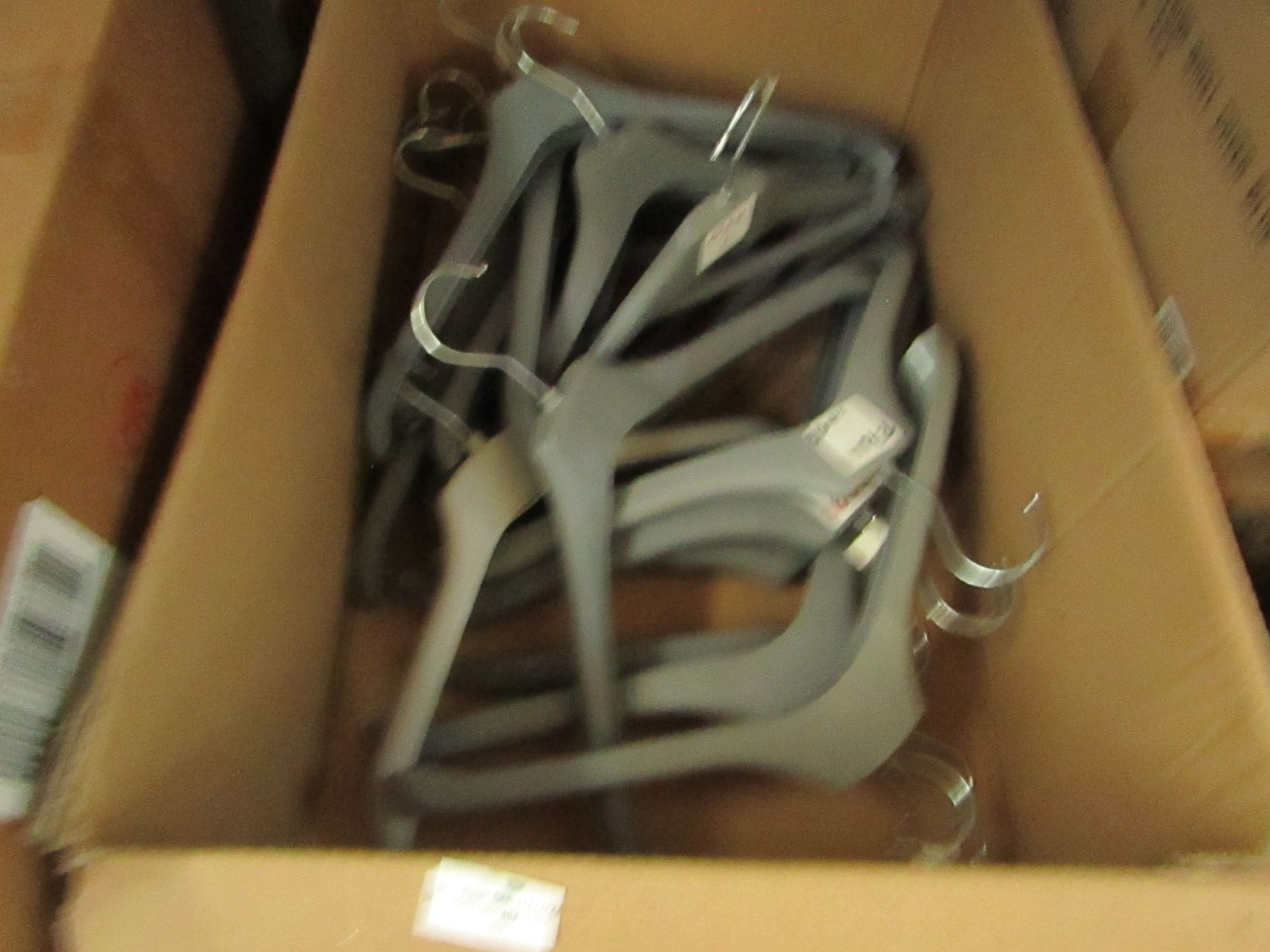 1x Box Containing Approx 20x Plastic Grey Hangers - Used Condition.