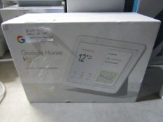 Google Nest Home Hub in original packaging powers on and asks to get app