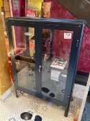 Steel / Glass cabinet with quantity of Tom Ford glasses cases
