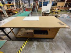 Mobile wooden workbench with contents