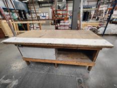Wooden workbench with contents
