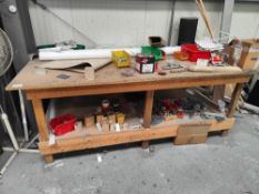 Wooden workbench with contents